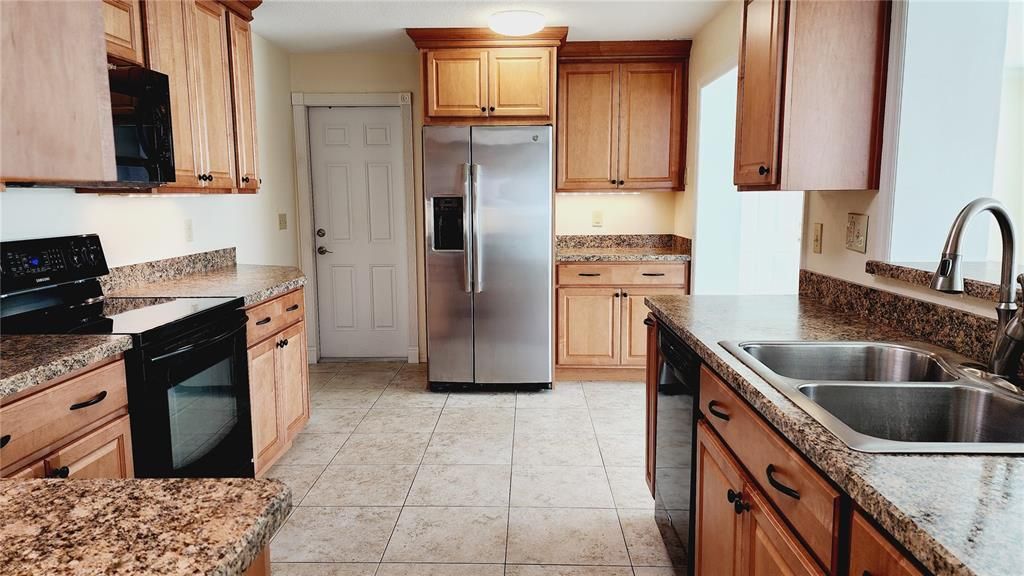 Check out this gorgeous updated kitchen with loads of cabinets and counter space.