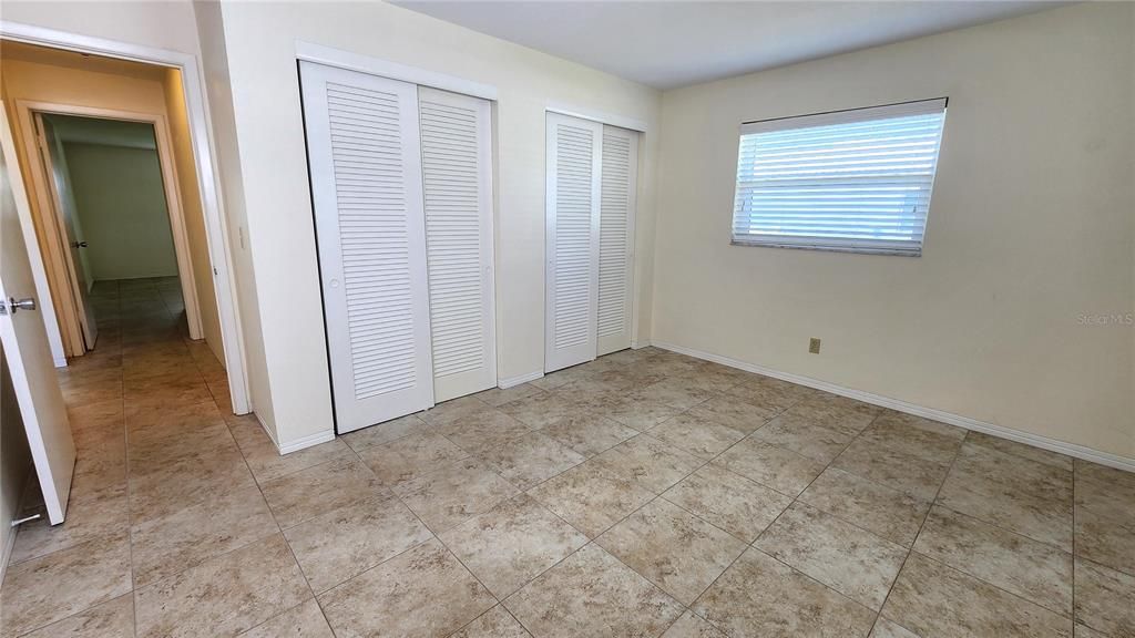 Guest Bedroom has double closets for plenty of storage.