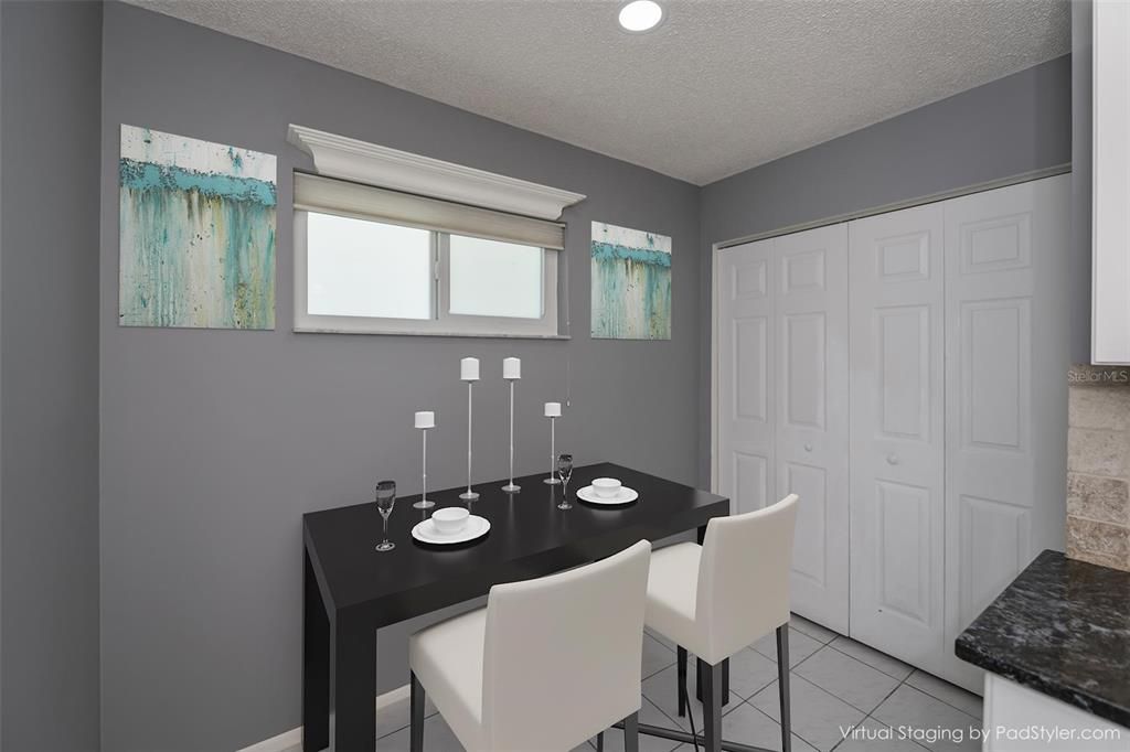 Informal dining area with full wall pantry closet.