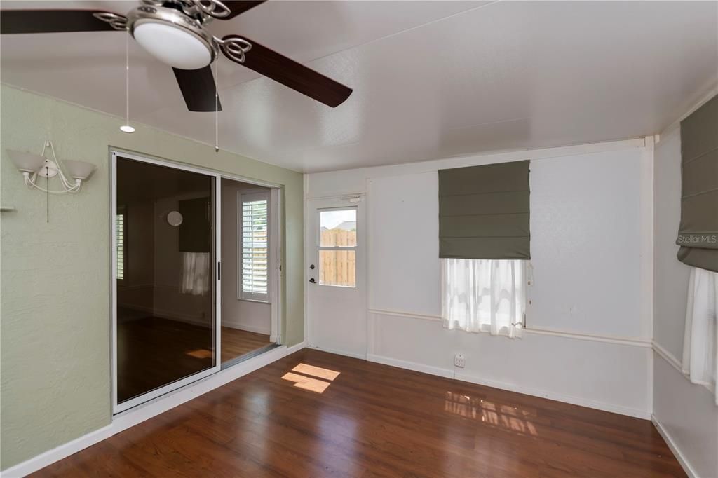 Door opens to the spacious open patio with newly added privacy fence.