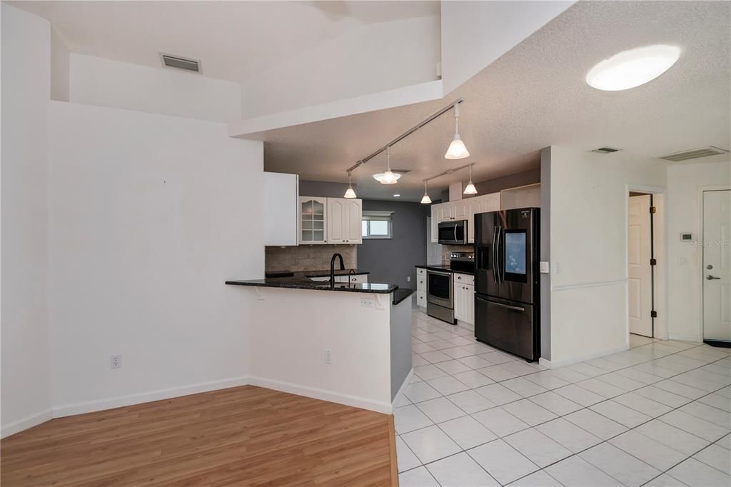 Upscale, eat-in kitchen is finely appointed and features a full wall pantry!