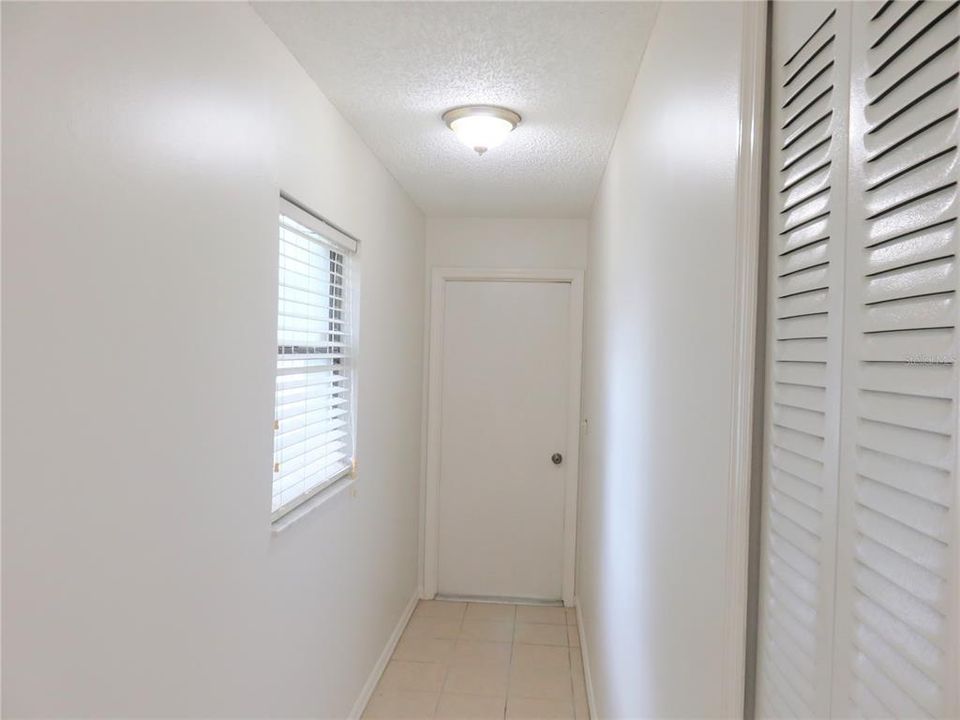 Hall way to two car garage, Laundry and extra storage space.