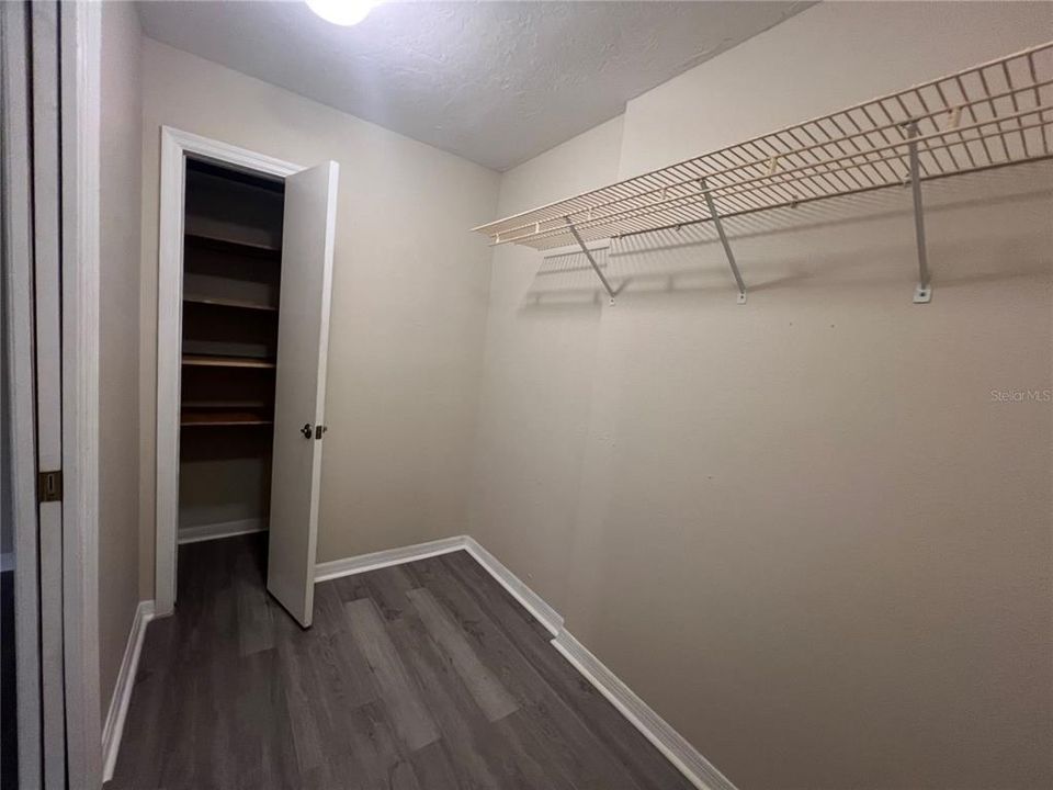 Main bedroom walk-in closet with bonus storage space