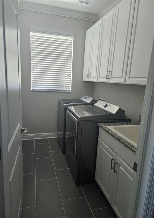 Laundry Room with Utility Sink and Lots of Storage Cabinets