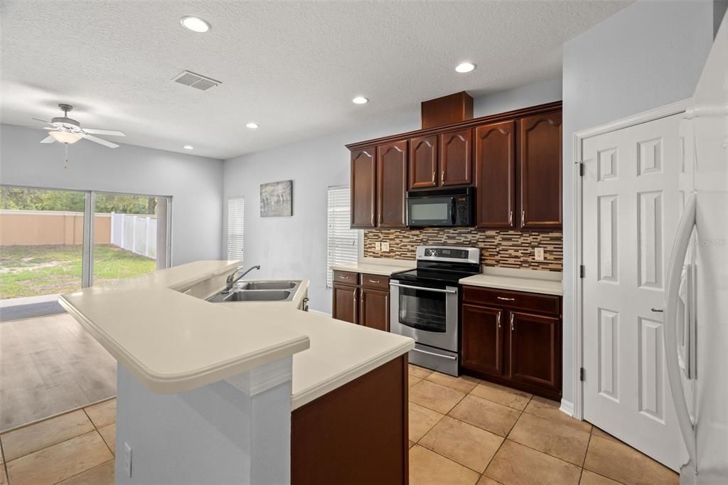 Another view of open kitchen.  A perfect cooks "triangle" space for efficiency.