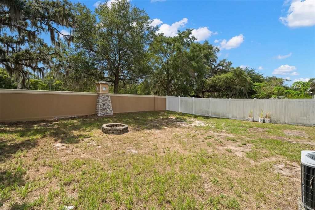 Another view of the back yard from the gate on the left side of the house.