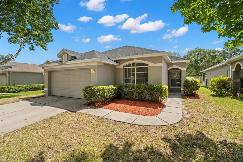 9332 Beaufort Ct., New Port Richey, FL -- a lovely 3/2/2 plus den home is waiting for new owners in this gated community which offers mature landscaping and nice lot sizes. New mulch in the yard AND a brand new roof on this home!