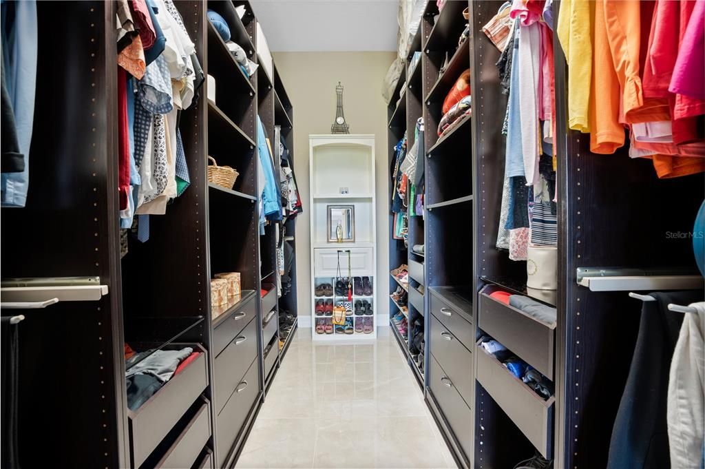 Custom built cabinets in primary closet.