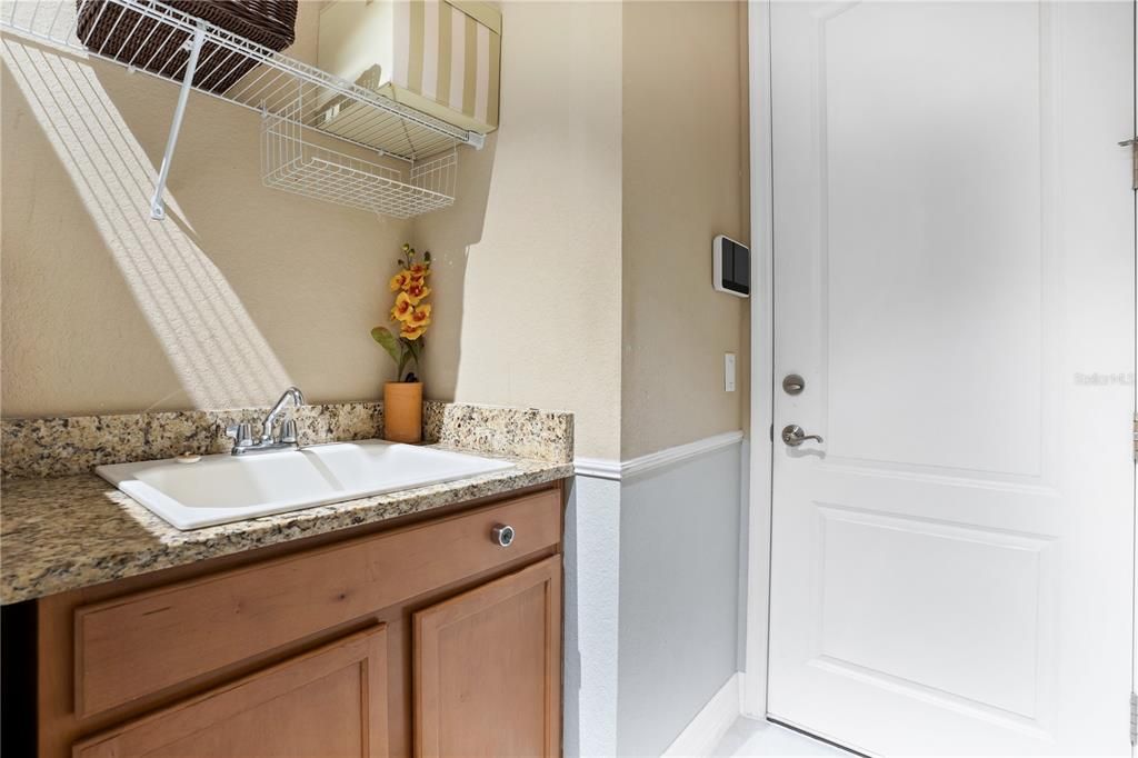 Laundry room with wash sink