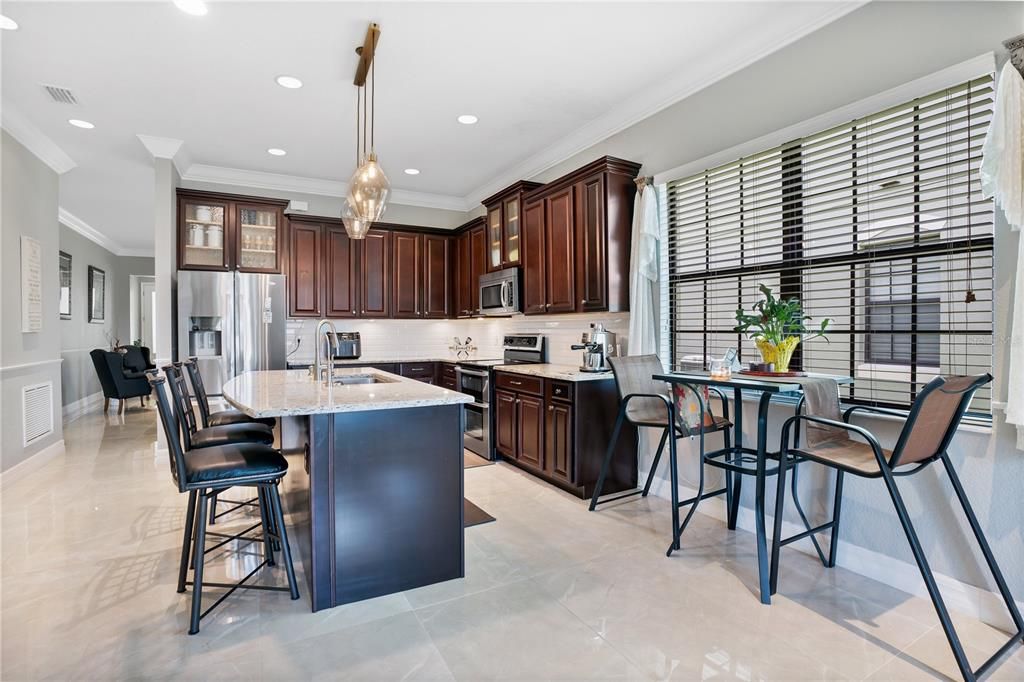 Kitchen with breakfast area seating.