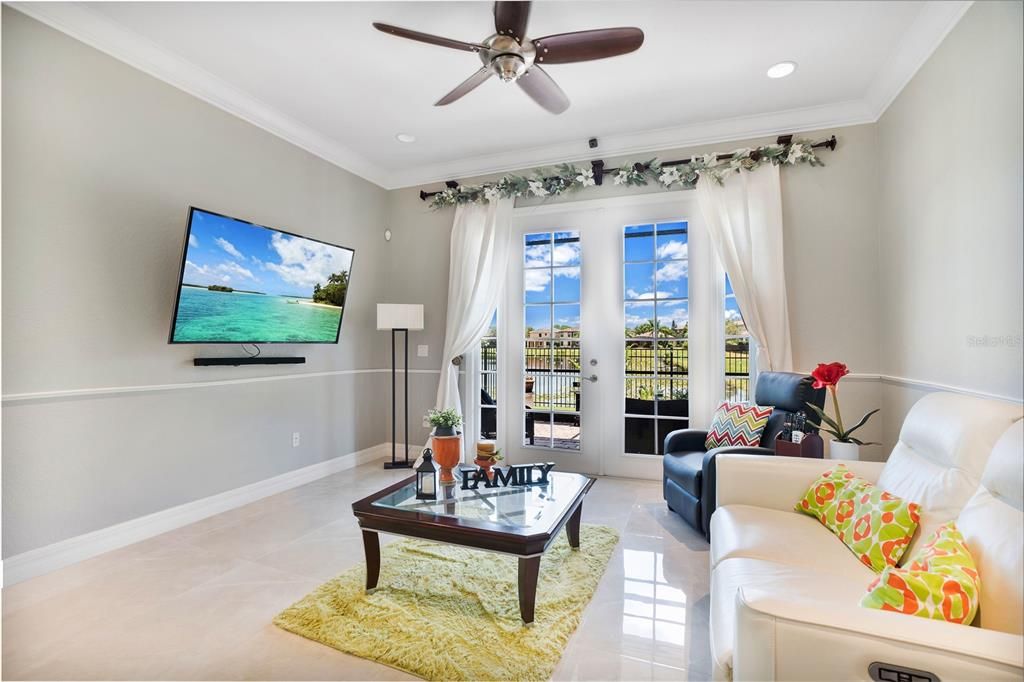 Family room with view of outside pond