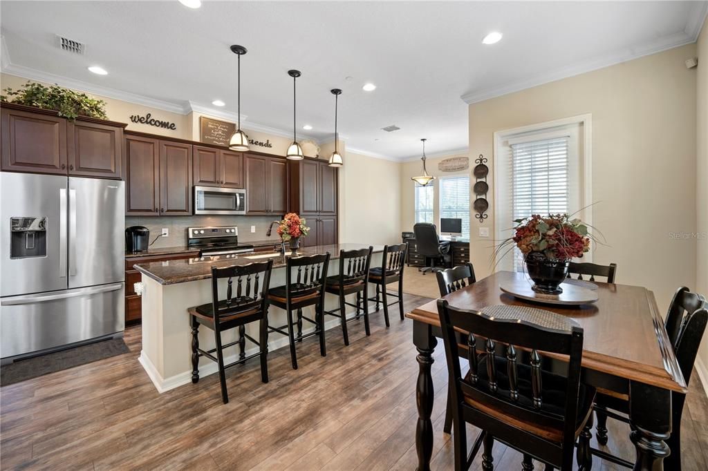 The open floor plan includes a Gourmet kitchen that is open to dining and extra sitting room