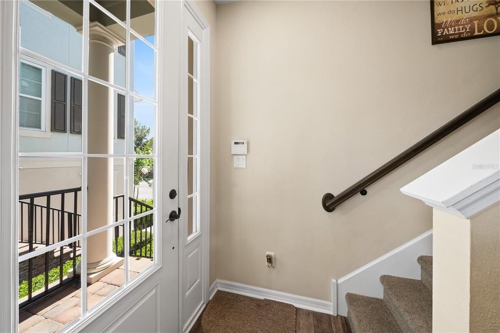 Guests enter through the brick stair walk up