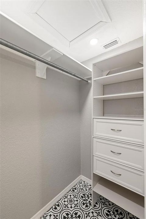 Custom shelves in primary walk in closet