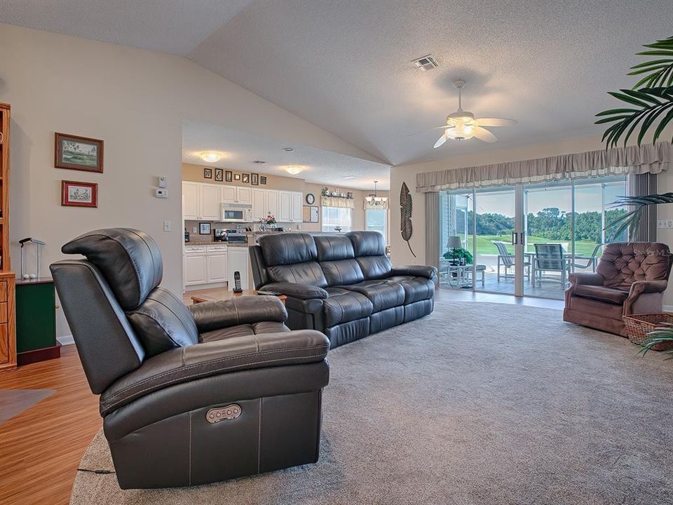 VAULTED CEILINGS, GREAT FLOORING THROUGHOUT AND PLENTY OF SPACE IN THIS OPEN-FLOOR LIVING AREA