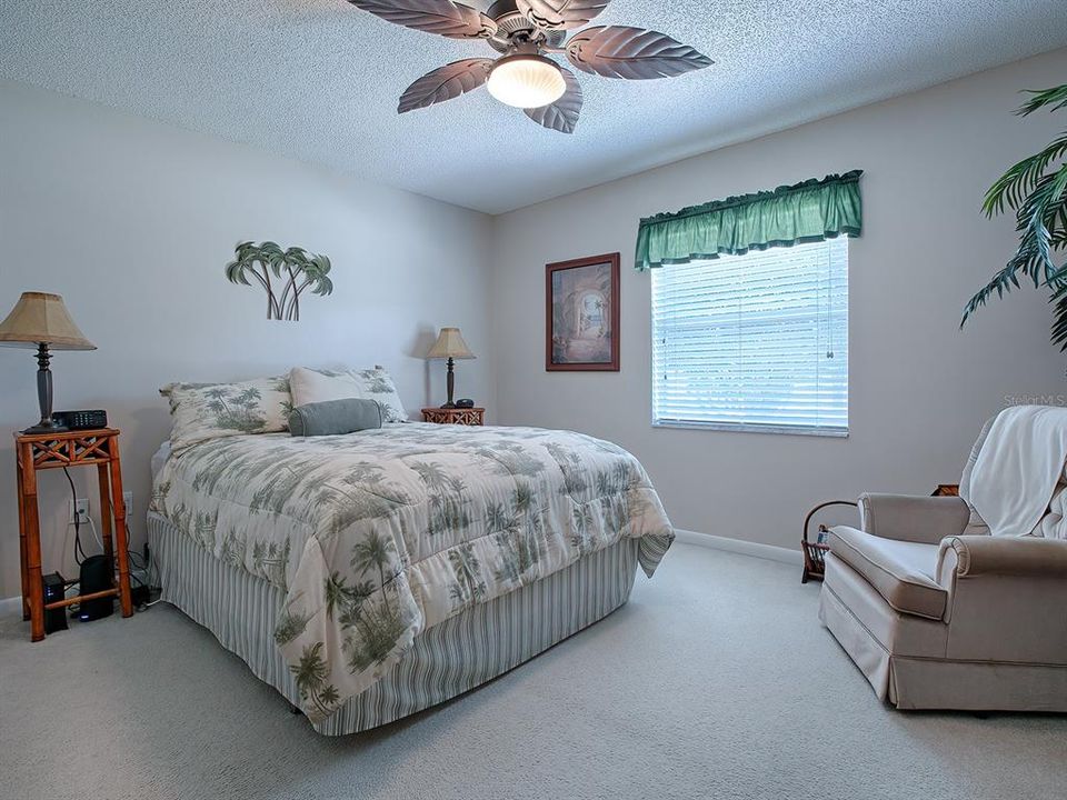 COZY AND PEACEFUL GUEST BEDROOM...  NOTE THE UNIQUE, DECORATIVE CEILING FAN