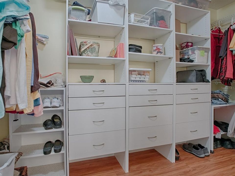 BUILT-IN SHELVING AND DRAWERS IN THE WALK-IN CLOSET