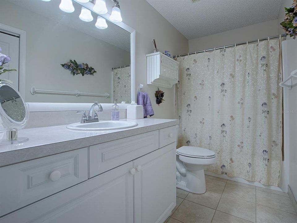 GUEST BATH HAS A TUB/SHOWER COMBO