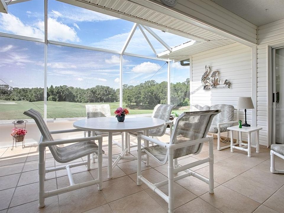 THIS SCREENED LANAI HAS BEEN ENLARGED... ENTERTAINING FRIENDS AND FAMILY IS A BREEZE FROM HERE!
