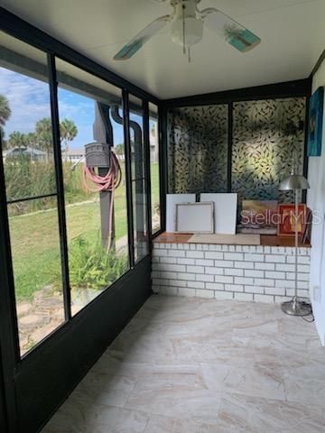 Florida room with glass and screen enclosure