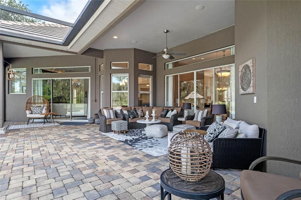 This expansive outdoor area is perfect for hosting gatherings or enjoying peaceful moments.
