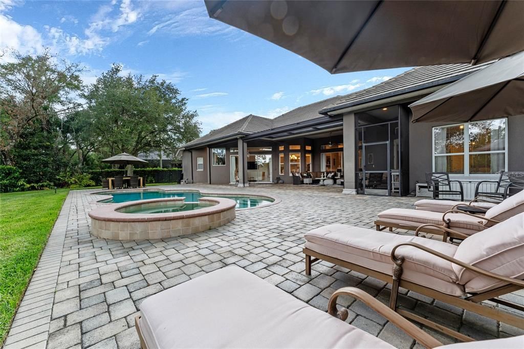 The outdoor space features ample seating areas for relaxation and entertaining.
