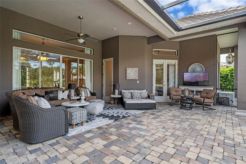 This inviting lanai seamlessly connects indoor and outdoor living spaces.