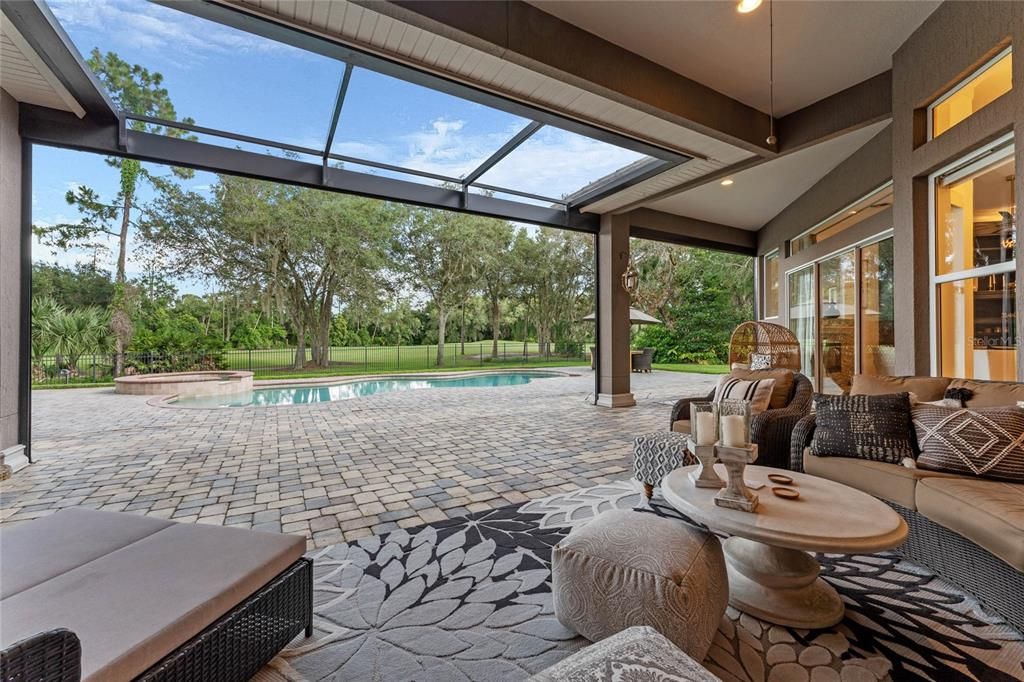 Enjoy the spacious lanai with a retractable screen, perfect for year-round outdoor living.