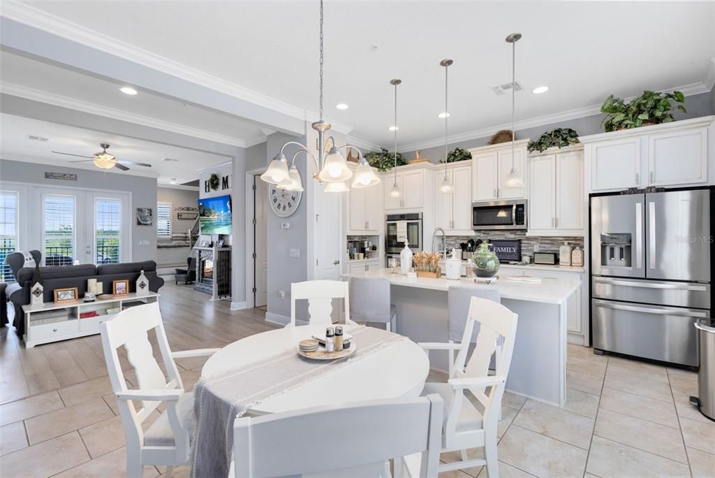 The dining room is in the foreground looking towards the kitchen.