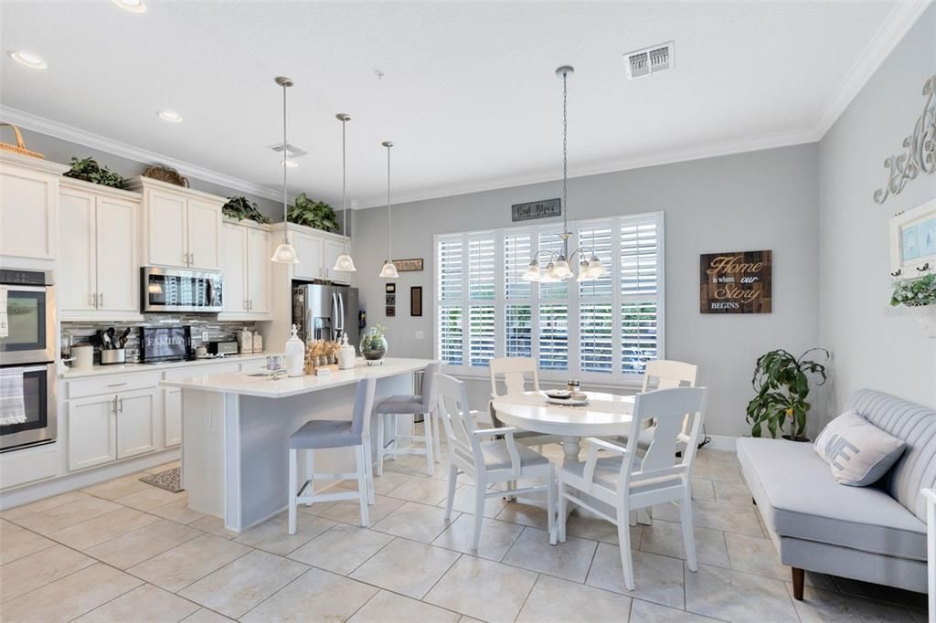 Elegant yet functional kitchen with all stainless steel appliances.  Quartz counters and plantation shutters add that feeling of quality.