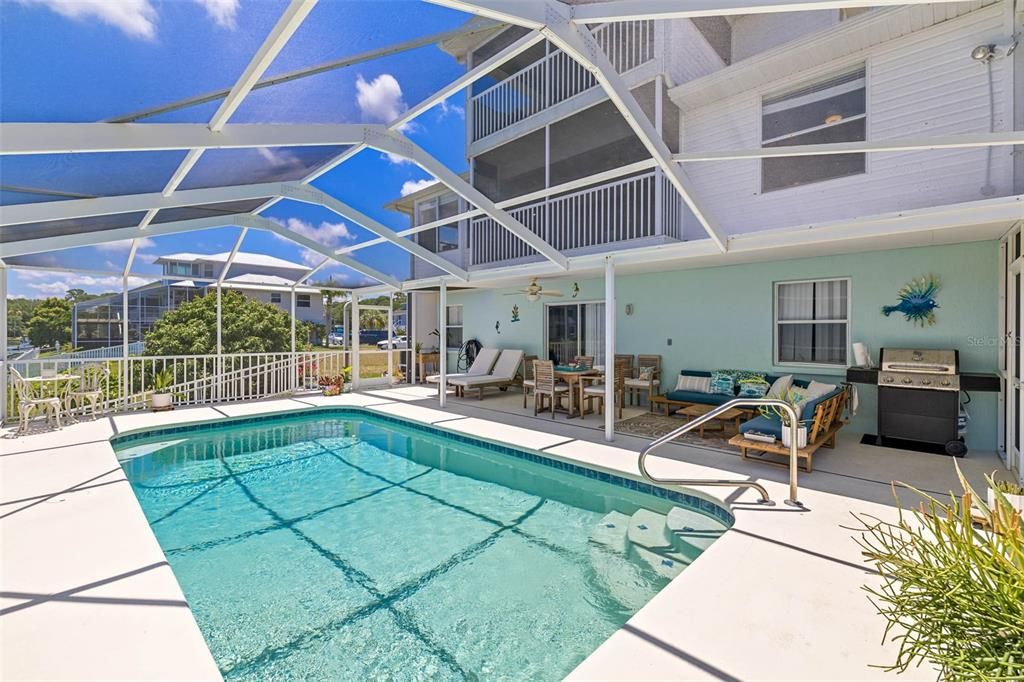 Pool with screened enclosure.