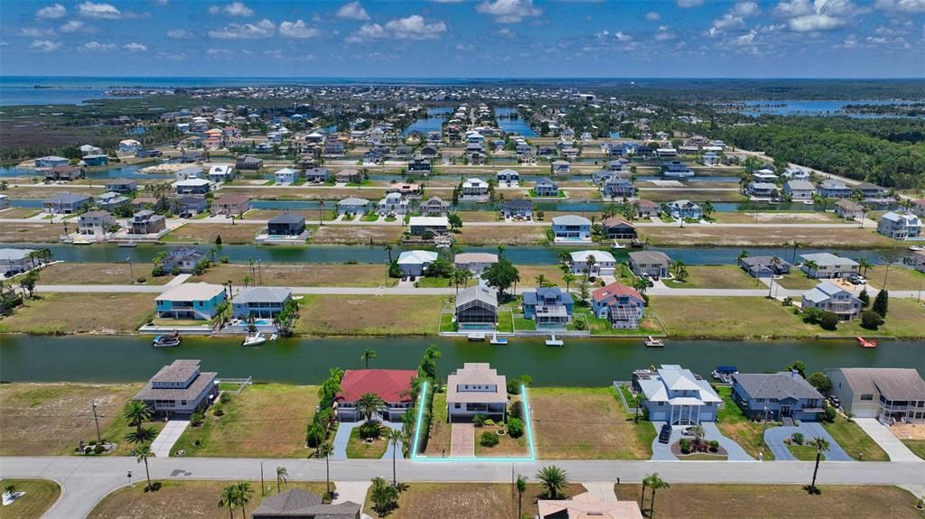 Additional aerial view of canal and location of residence.