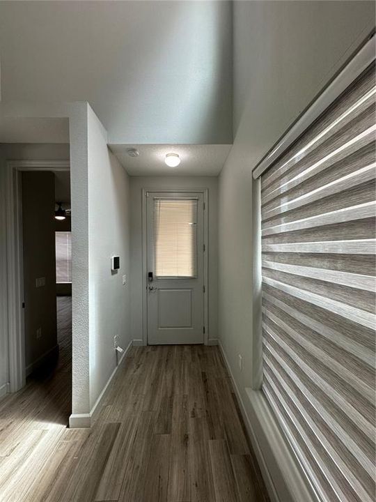 Hallway leading to Front Door, First Floor Bedroom and First Floor Bathroom