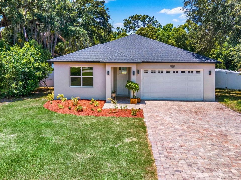 Gorgeous Curb Appeal and extra long brick paver driveway