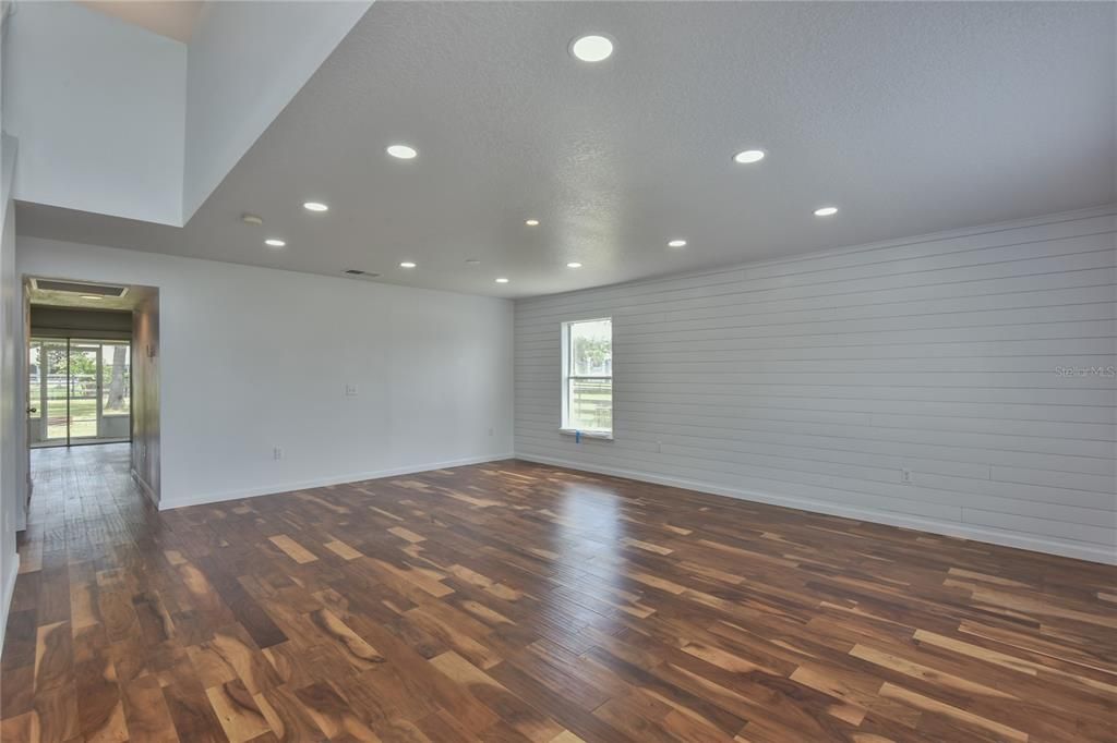 The two-story foyer lets into the Living Room