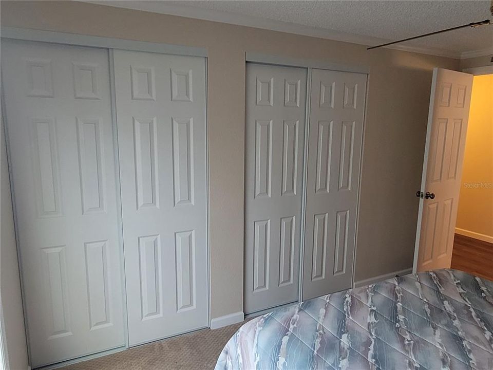 Double closet in guest bedroom