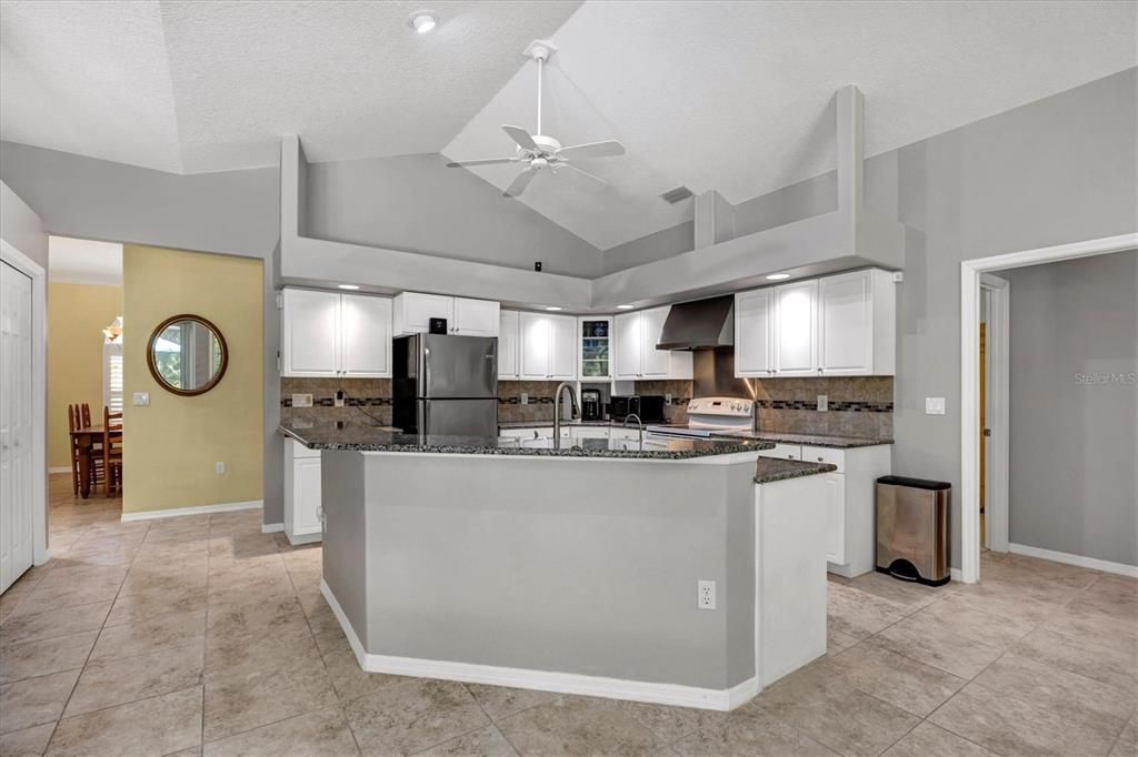 kitchen with granite counters and breakfast bar