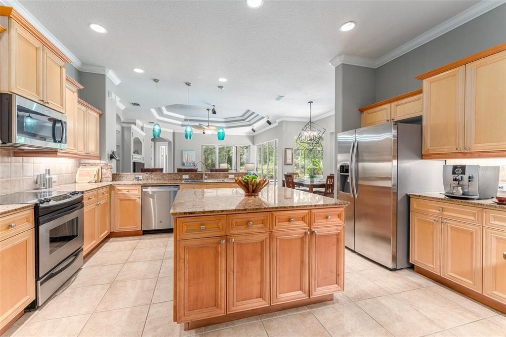 Kitchen with Abundant Wood Cabinetry & Granite Counter Space