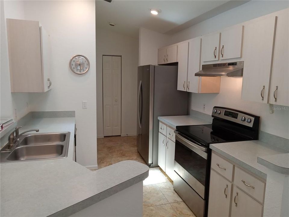 Laundry Closet, Utility Closet and Garage entrance at other end of Kitchen