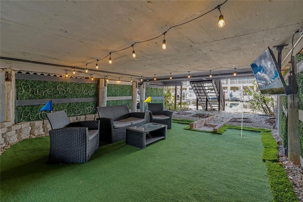 COVERED PATIO WITH PUTTING GREEN!