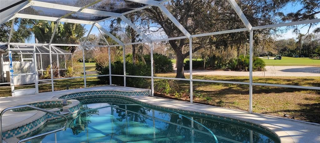 Pool and lanai with view of the 12th fairway