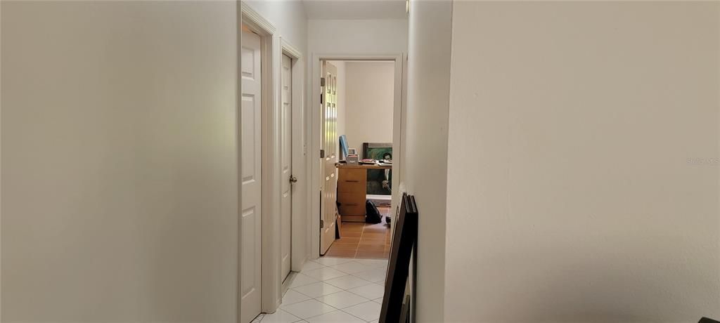 From the Kitchen the hallway leads to a large storage room, garage entry, 2nd Bedroom and 2nd Bath