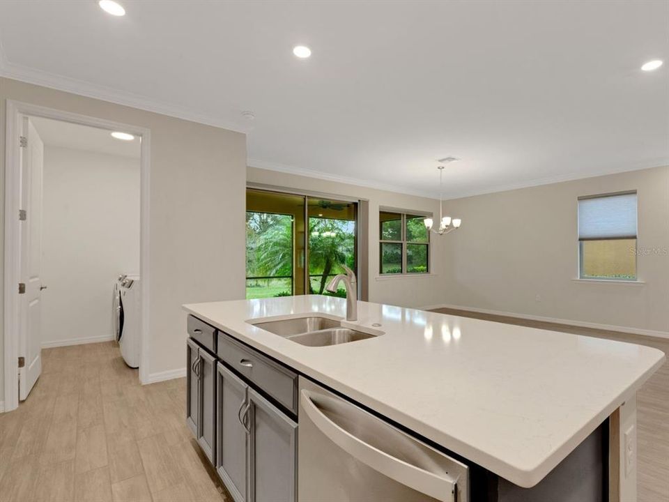 Kitchen island and entrance to laundry room