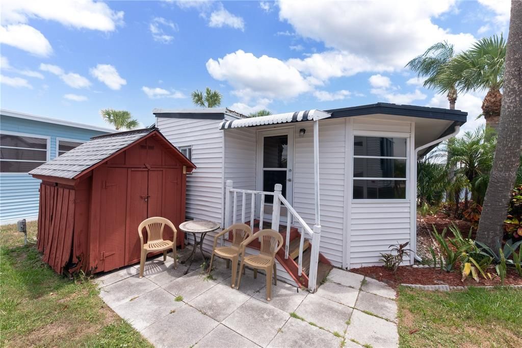 BACK DOOR TO SHED WITH WASHER AND DRYER