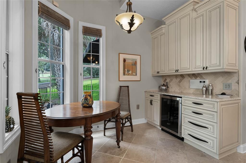 Adorable Eat-In Kitchen & Beverage Center with Views