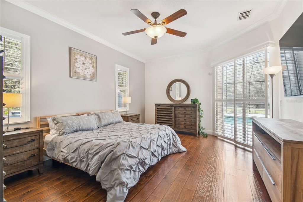 Master bedroom with sliding doors leading to the pool area. This rooms measures 18x14 with a large walk in closet.