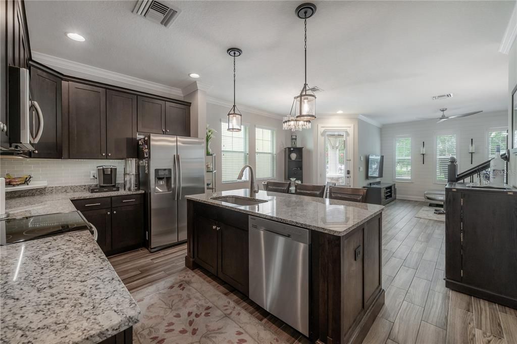 Flowy kitchen with state-of-the-art stainless steel appliances