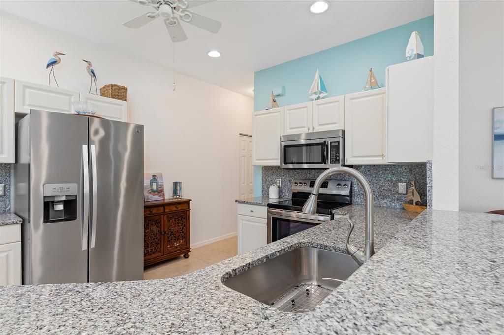 Another View - Kitchen and hallway to the Pantry, Laundry and Attached Garage