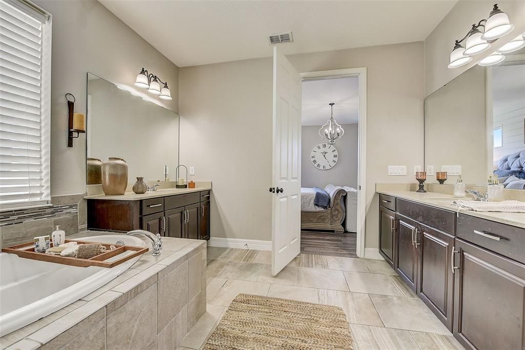 Separate vanities with large makeup station area