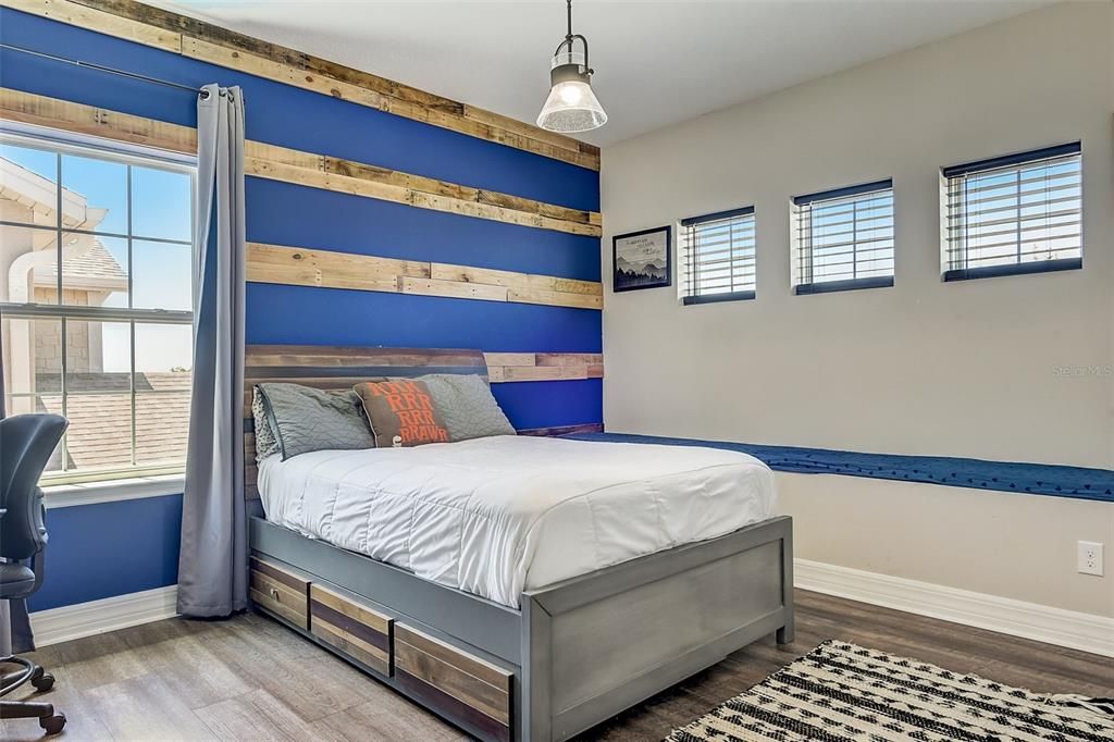 Bed 3 with wood accent wall